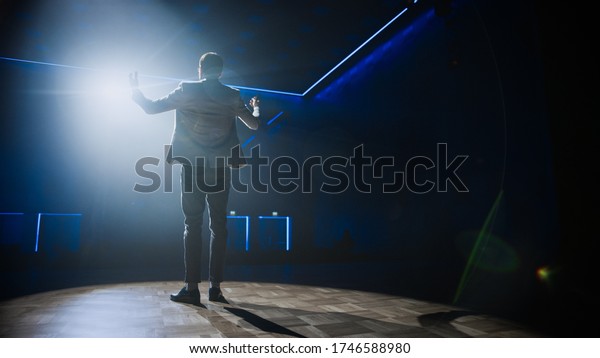 Famous Entertainer Gets on the Stage, Greets\
Audience, Starts Performance. Software Company Founder, Tech\
Marketing Guru Making a Pitch, Presentation Speaker Giving Talk.\
Cinematographic Shot