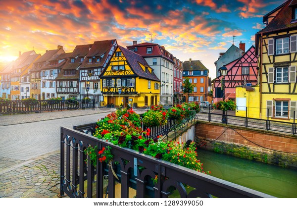 Famous excursion place and travel destination.\
Wonderful street view with colorful buildings and flowers, Colmar,\
France, Europe
