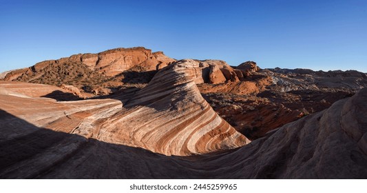 The famous Fire Wave rock formation in the Valley Of Fire at sunset. - Powered by Shutterstock