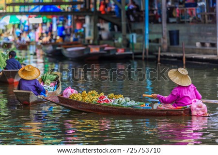 Famous floating market in Thailand, Damnoen Saduak floating market, tourists visiting by boat, Ratchaburi, Thailand.