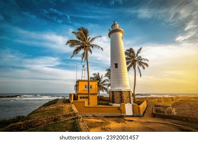 Famous Fort Galle lighthouse at beautiful orange sunset. Sri Lanka