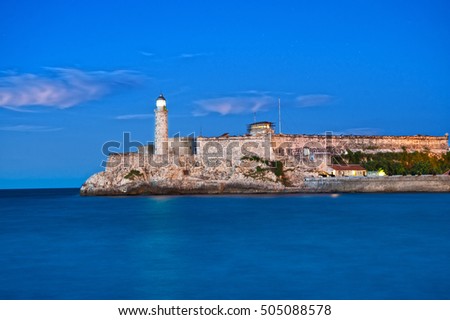 Famous fortress and lighthouse of El Morro in the entrance of Havana bay, Cuba at dusk