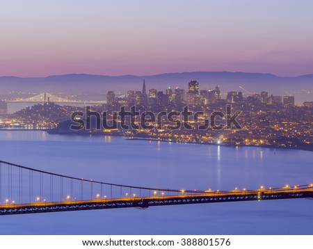 The famous Golden Gate Bridge with Sanfrancisco skyline around sun rise time, SFO, California
