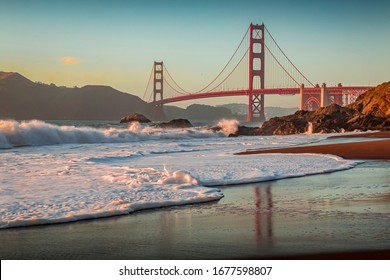 Famous Golden Gate Bridge view from Baker Beach at sunset in San Francisco, California