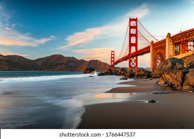Famous Golden Gate Bridge view from the hidden and secluded rocky Marshall's Beach at sunset in San Francisco, California - Shutterstock ID 1766447537