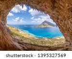 The famous "Grande Grotta", one of the most popular climbing fields of Kalymnos island, Greece. In the background, Telendos island.