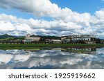 A famous Hakka country in Taiwan, Kaohsiung called Mino. The house, mountain and green field reflect on the water. Admire  nature of the entire town of Mino.