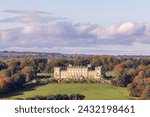 The famous Harewood House in Leeds West Yorkshire in the UK taken from across a large field in the British country side in the Autumn time 