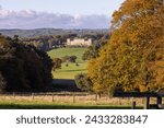 The famous Harewood House in Leeds West Yorkshire in the UK taken from across a large field in the British country side in the Autumn time 