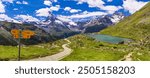 famous hiking routes in Switzerland , Valais canton - five most beautiful mountain lakes in Zermatt. Panoramic view of Stellisee lake and Matterhorn iconic mountain. trail with directions