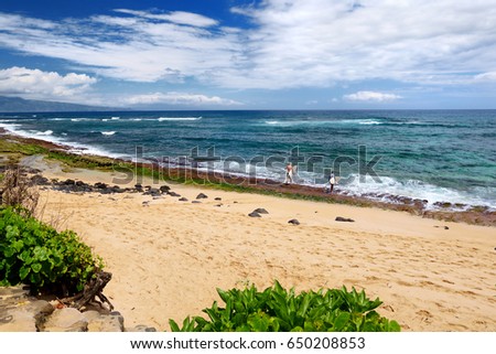 Famous Hookipa beach, popular surfing spot filled with a white sand beach, picnic areas and pavilions. Maui, Hawaii, USA.