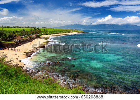 Famous Hookipa beach, popular surfing spot filled with a white sand beach, picnic areas and pavilions. Maui, Hawaii, USA.