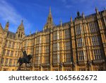 famous Houses of Parliament and statue of King Richard the Lionheart, in the Westminster Borough - sunny day with lots of architectural details. London, England