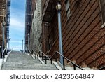 The famous Joker stairs with a beautiful blue and sunny sky in the famous neighborhood of The Bronx, the famous borough of New York in USA.