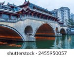 Famous landmark of Chengdu - Anshun bridge over Jin River illuminated at night, Chengdue, Sichuan , China