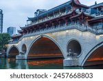 Famous landmark of Chengdu - Anshun bridge over Jin River illuminated at night, Chengdue, Sichuan , China