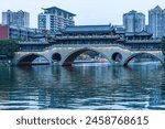 Famous landmark of Chengdu - Anshun bridge over Jin River illuminated at night, Chengdue, Sichuan , China