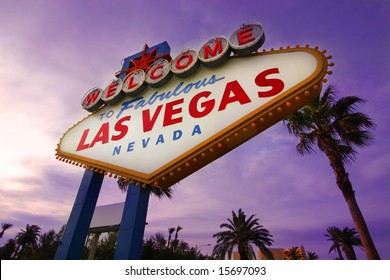 Famous Las Vegas Welcome Sign at sunset with palm trees in the background