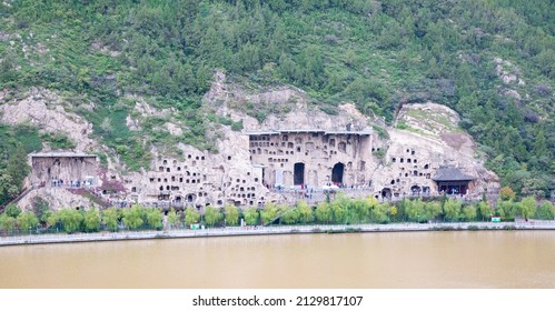 Famous Longmen Grottoes (statues of Buddha and Bodhisattvas carved in the monolith rock near Luoyang in Hennn province, China)