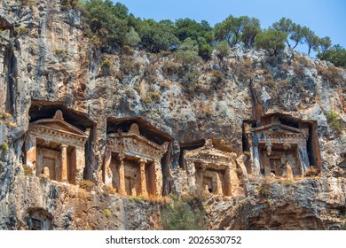 Famous Lycian Rock Tombs of ancient Caunos town, Dalyan, Mugla, Turkey. Rock-cut temple tombs in Kaunos, one of the ancient architectural wonders of Turkey, carved into the cliffs