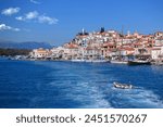 Famous main picturesque village of Poros island featuring clock tower, Saronic Gulf, Greece