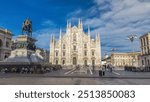 The famous Milan Cathedral (Duomo di Milano) and monument to Victor Emmanuel II on the Piazza del Duomo in Milan, Italy. Blue cloudy sky at summer day. Milan Duomo is the largest church in Italy.