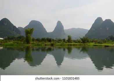 The famous mountain tops of Guilin, China. A view from the river.