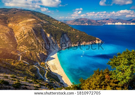 Famous Myrtos beach from overlook, Kefalonia (Cephalonia), Greece. Myrtos beach, Kefalonia island, Greece. Beautiful view of Myrtos beach, Ionian Island, Kefalonia (Cephalonia), Greece.