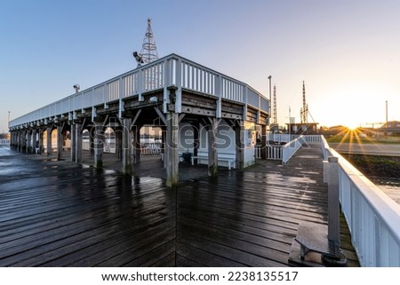 ‘Alte Liebe’ (‘Old Love’), famous observation deck in Cuxhaven, Germany at the river Elbe at sunset