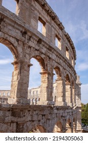 Famous Old Historic Roman Amphitheater In The Citycenter Of Pula, Istria In Croatia. An Old Coliseum And Arena, A Populair Touristic Monument.