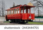 The famous old red tram. A retro tram stands on the street to attract tourists.