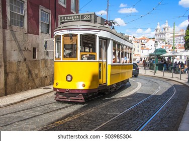 Famous Old Yellow Tram On Street Of Lisbon/Lisboa.