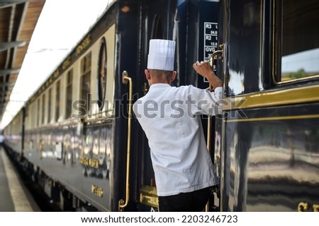 Famous Orient Express long distance passenger train stopped in Bucharest central train station.
