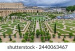 Famous palace Versailles with beautiful gardens and fountains aerial timelapse from top. The Palace Versailles was a royal chateau. Paris, France.