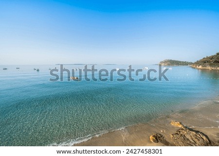 Famous Plage de Jean Blanc with turquoise water on French Riviera, France