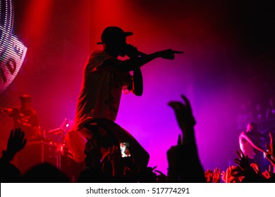 Famous Rap Band Asap Mob Performing Live Hip Hop Music Show On Nightclub Stage. Silhouette Of Rapping Singer With Microphone On Scene. Rapper Concert In Crowded Music Hall EUROPE-15 NOVEMBER,2016