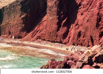 The famous Red Beach in Santorini, Greece with clouds and blue sky