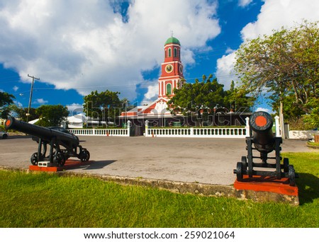 Famous red clock tower on the main guardhouse at the Garrison Savannah. UNESCO garrison historic area Bridgetown, Barbados