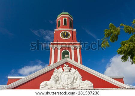 Famous red clock tower on the main guardhouse at the Garrison Savannah. UNESCO garrison historic area Bridgetown, Barbados