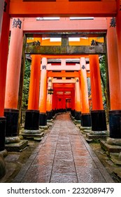 Famous red gates at Fushimi Inari Taisha in Kyoto Japan. Translation on gates: payment service
