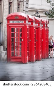 Famous red telephone booths in Covent Garden street, London, England, United Kingdom