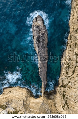 Similar – Aerial Drone View Of Dramatic Ocean Waves Crushing On Rocky Landscape