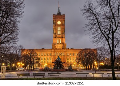 The Famous Rotes Rathaus In Berlin At Night In Winter Witrh Some Barren Tree Branches