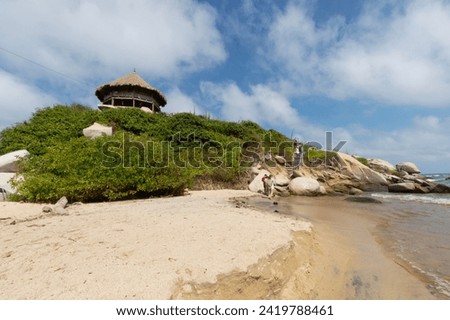 Famous roustic hut at the top of a rocky mountain located into cabo san juan beach at colombian tayrona national park