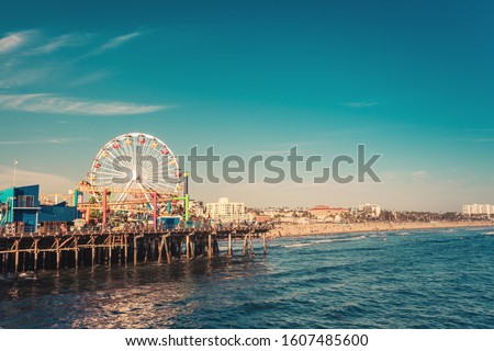 Famous Santa Monica ferris wheel amusement park in sunset light, no logo