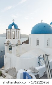 The famous Santorini blue domes the greek churches at nightfall
