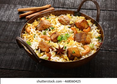 Famous Seafood Dish-King Fish Biriyani Or Pilaf With Indian Spices And Herbs In A Cast-iron Pot,