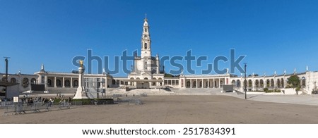 Famous Shrine in Portugal, complex of catholic religious buildings, pilgrim site devoted to the Virgin Mary. Large square and white Basilica of Our Lady of the Rosary of Fatima or Sanctuary of Fátima.