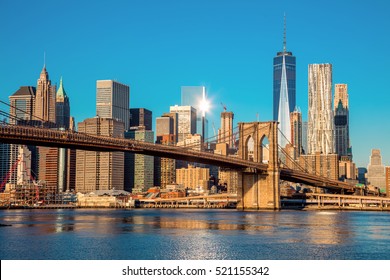 Famous Skyline of downtown New York, Brooklin Bridge and  Manhattan at the early morning sun light , New York City, USA - Shutterstock ID 521155342