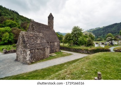 The Famous St. Kevin's Church Is A Small Historical Stone Chapel From The 12th Century. It Is Also Called St Kevin’s Kitchen Because Of Its  Circular Bell-tower. Glendalough, County Wicklow, Ireland